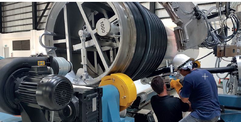 Krah Pipes employees during their first production on the new machine