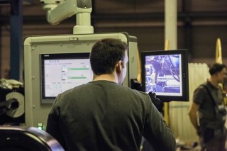 Two control screens, on the right side the video of the machine camera is shown