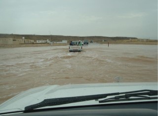 car driving through flooding